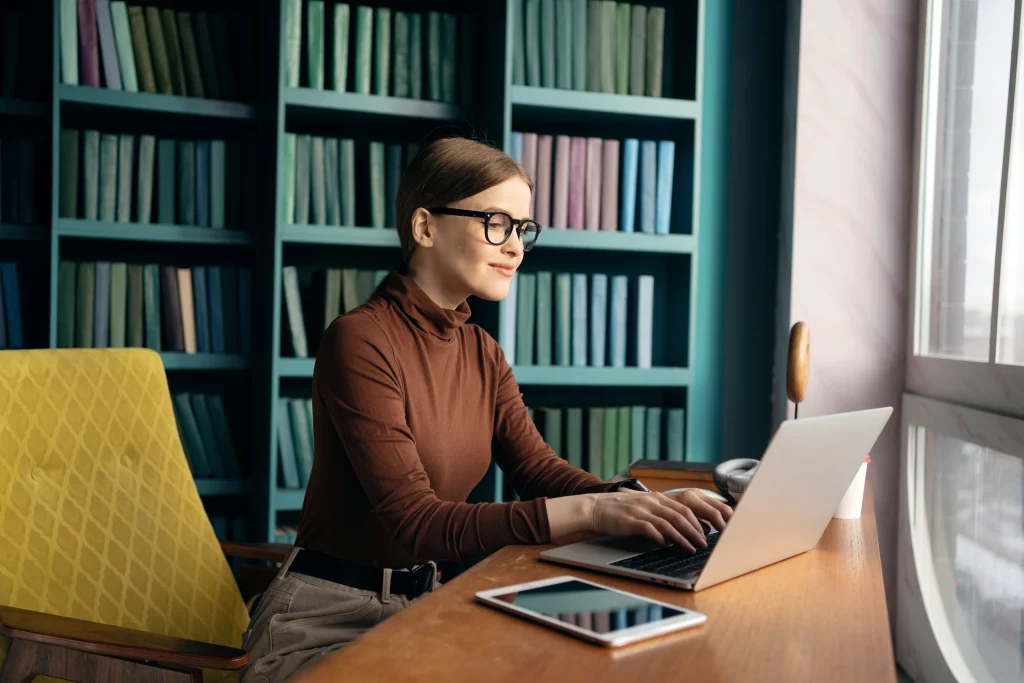 Professional woman working on laptop in modern home office